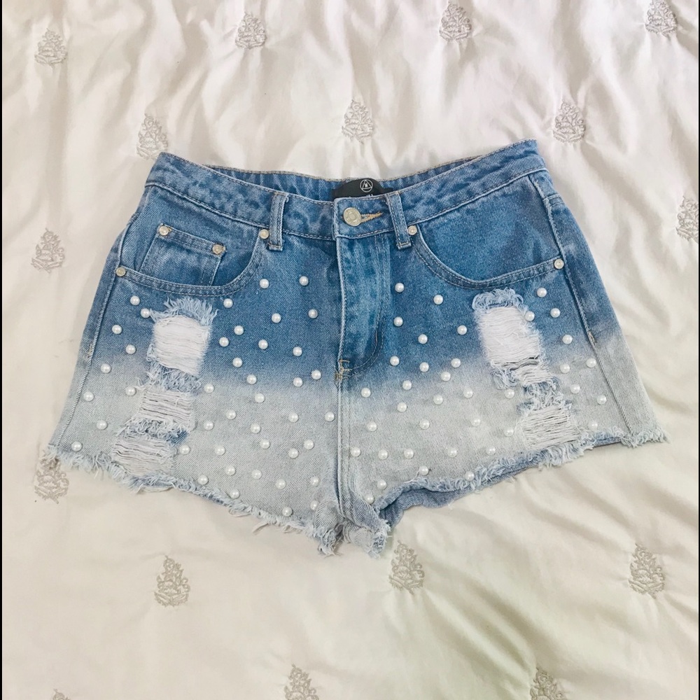 High-waisted distressed denim shorts